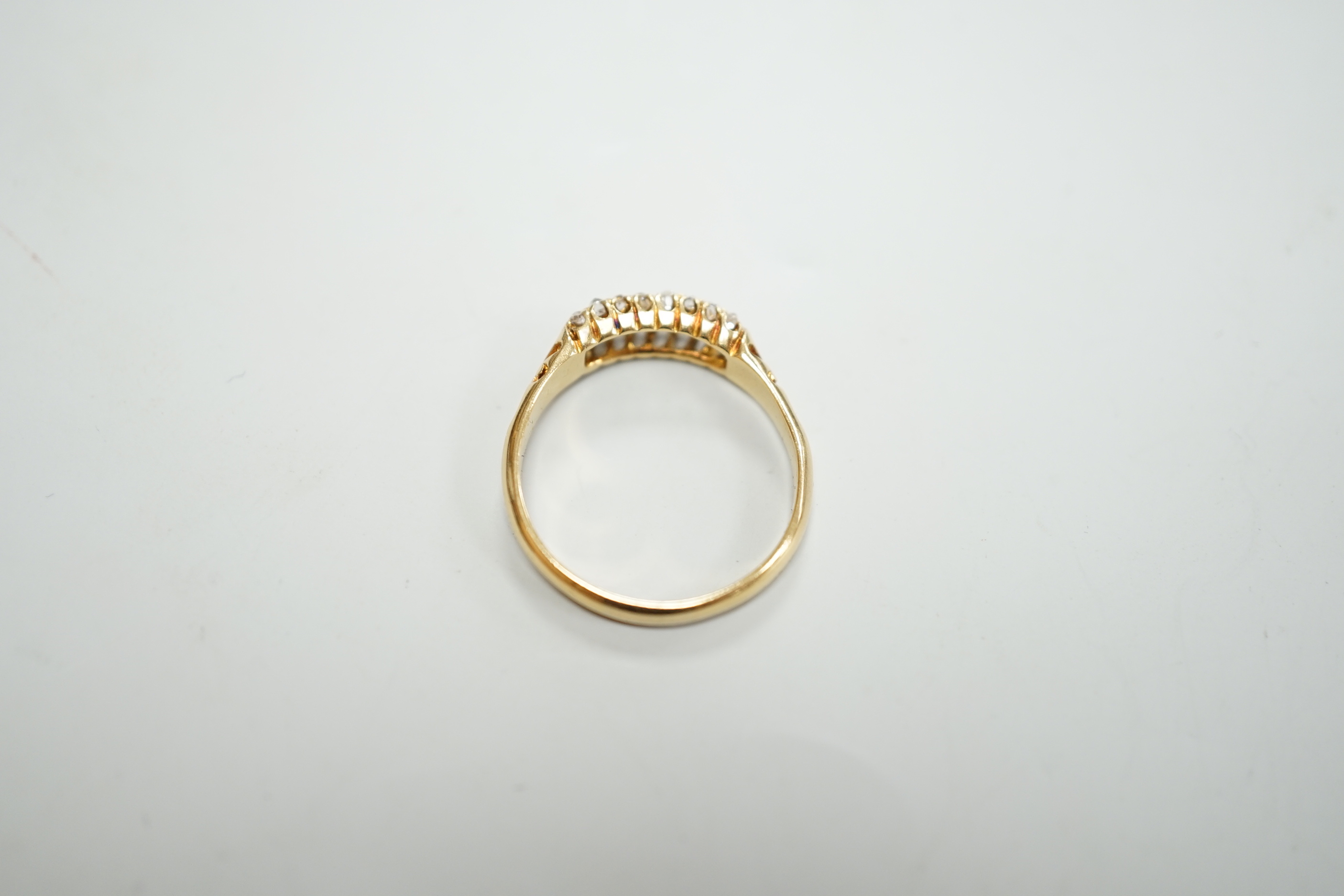 An 18ct and three row diamond cluster set ring, size P/Q, gross weight 3 grams.